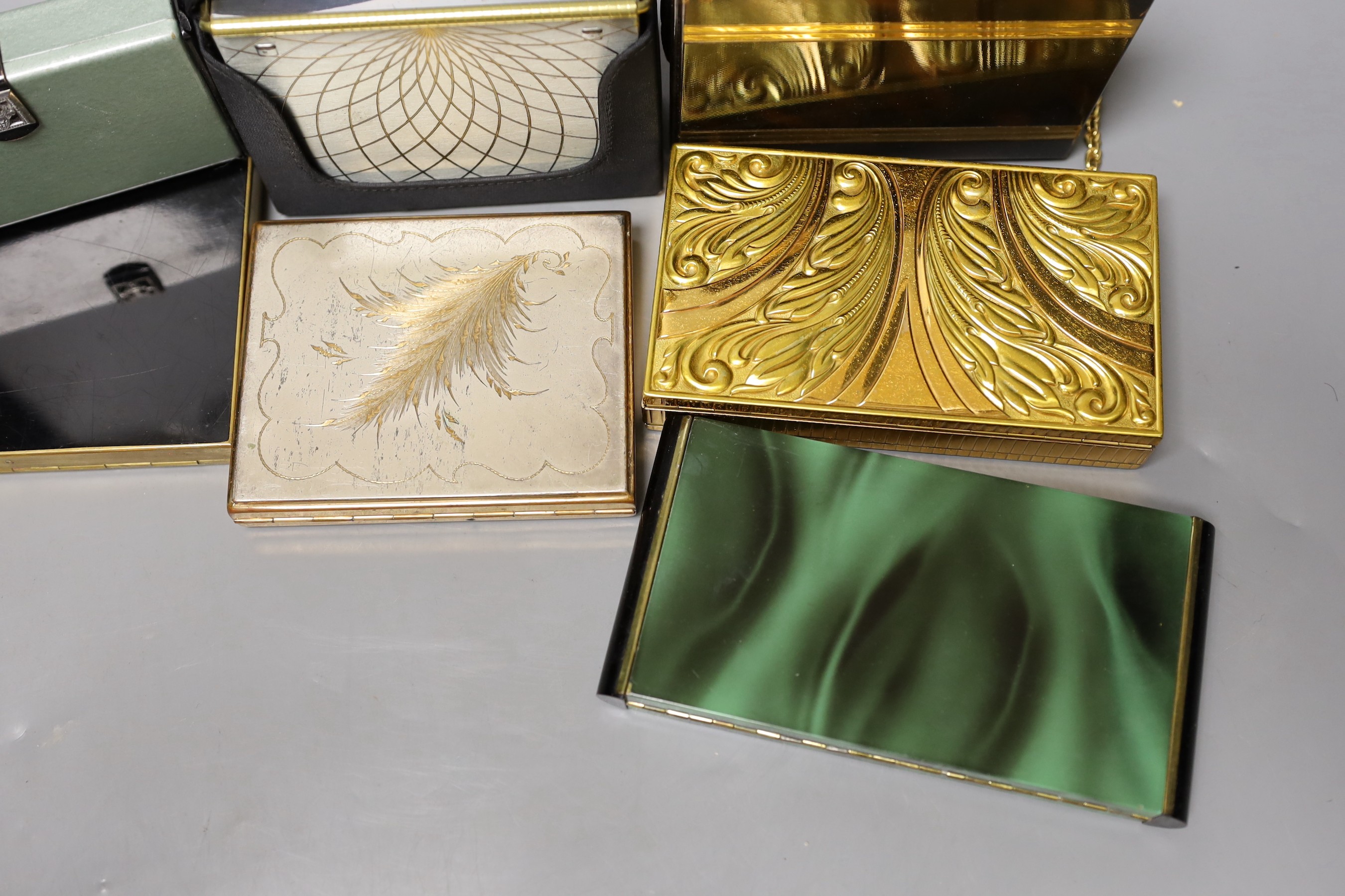 A collection of nine metal 1930’s and later ladies evening minaudière, two with handles, five enamelled, largest 15 cms x 12 cms